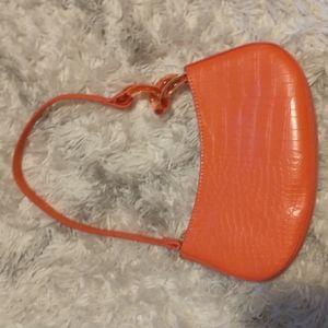 No Boundaries shoulder/carry bag in coral with geometric accents faux leather